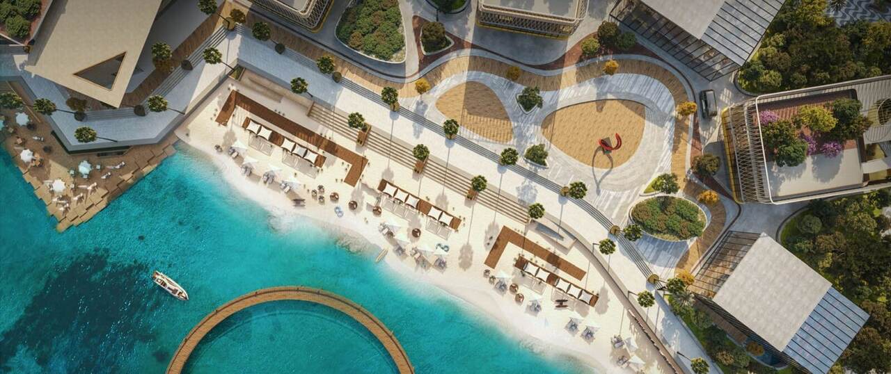 Aerial dusk render of the Al Khobar Pier pool deck